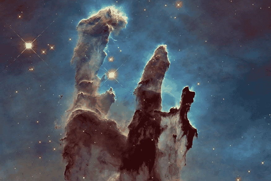 Pilares de gás e poeira em nebulosa, exemplo de estrutura presente em nuvens moleculares formadoras de estrelas