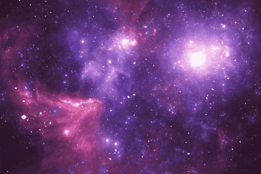 Região colorida de formação estelar com estrelas jovens surgindo em meio a gás e poeira cósmica