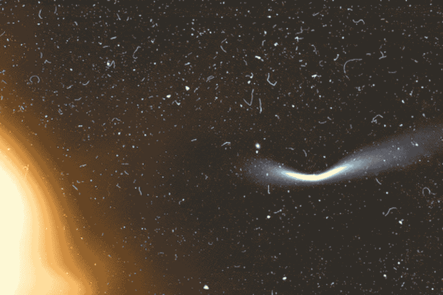 Cometa próximo do Sol com cauda curvada, mostrando que diferentes materiais podem produzir caudas apontando para direções distintas