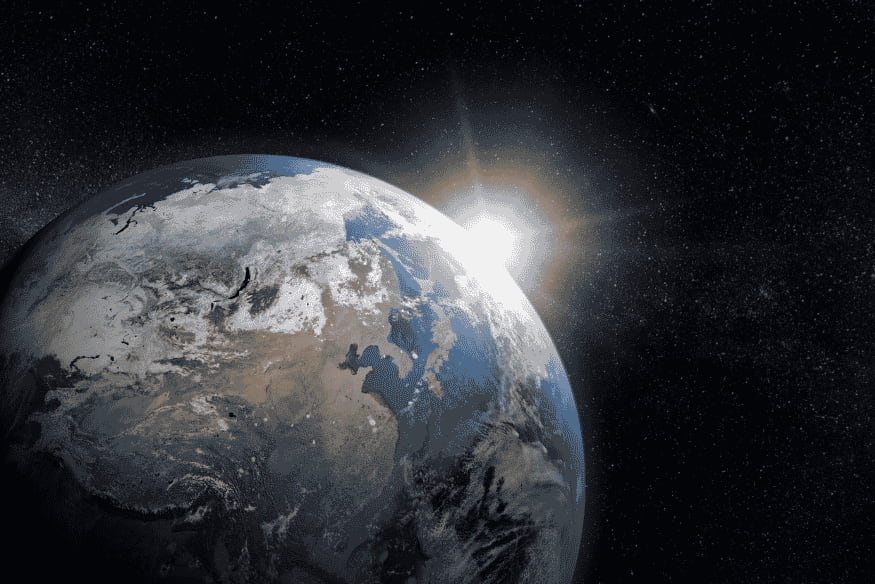 Terra vista do espaço com luz solar no horizonte relacionada ao movimento aparente dos astros